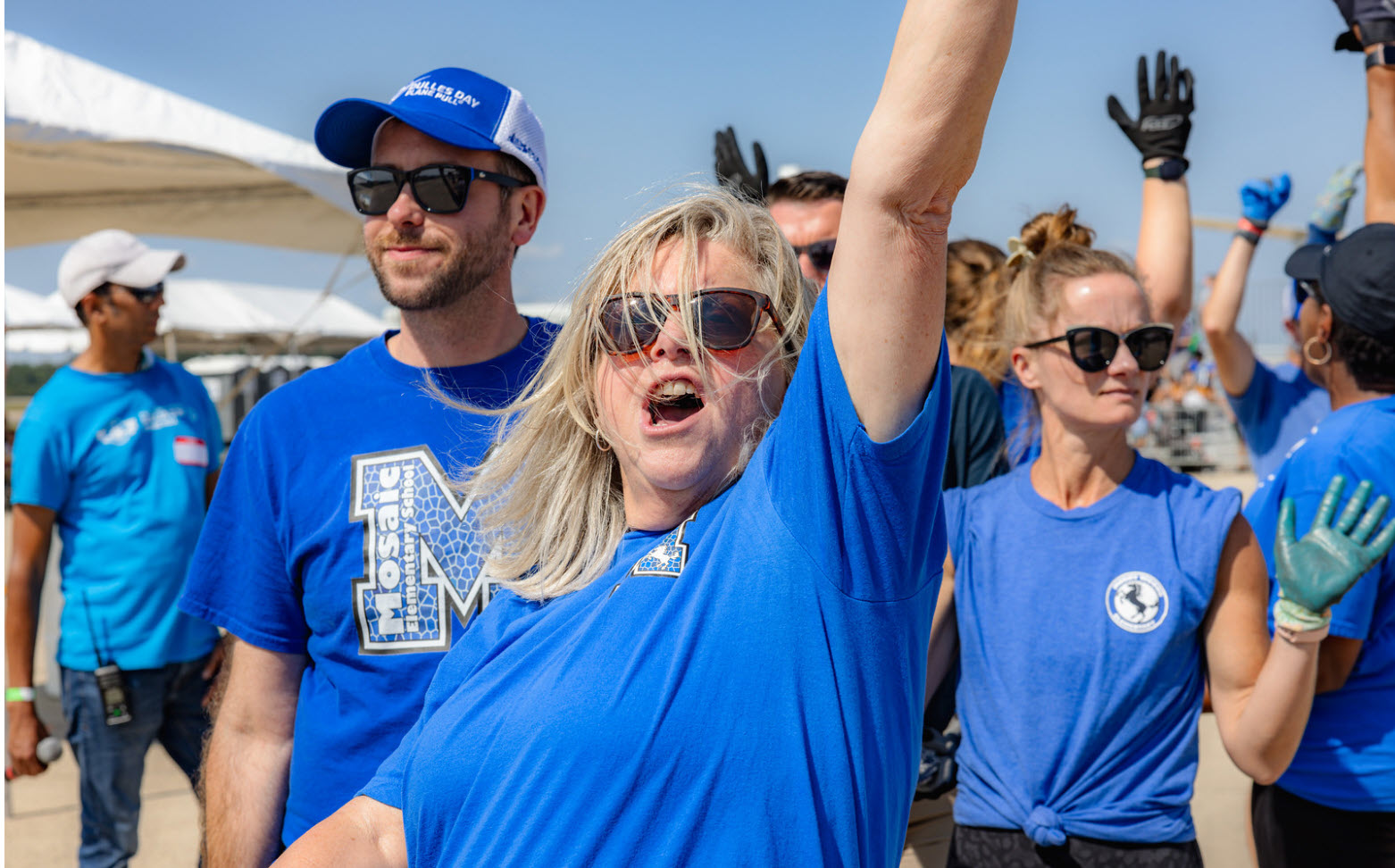 staff member cheering at plane pull