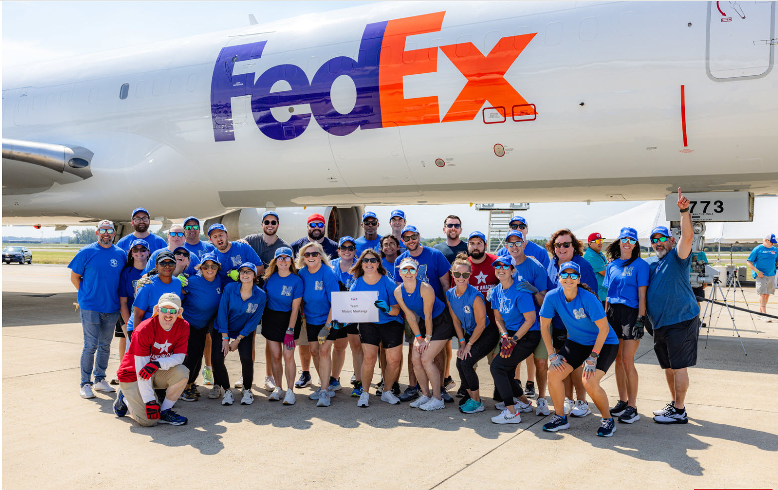 mosaic elementary staff at plane pull event