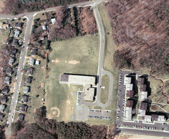 Aerial photographs of the Mosby Woods Elementary School site taken in 1937 and 1976.