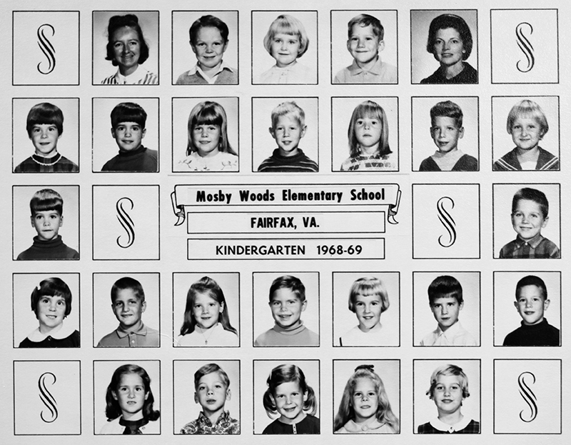 Black and white kindergarten class picture from the 1968 to 1969 school year. 24 students and two adults are pictured.